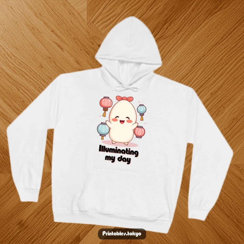 Funny cheerful mochi with rosy cheeks juggling lanterns, featured on a comfortable and warm hoodie.