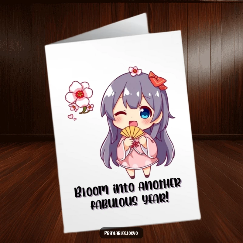 Funny Free Printable birthday card featuring a character joyfully waving a small fan amidst cherry blossoms, spreading festive cheer.